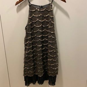 Black and gold fringed pleated dress with straps